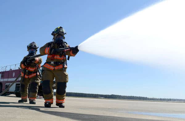 Firefighters with attack hose
