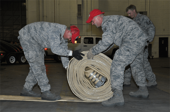 Air force engineers roll up supply hose