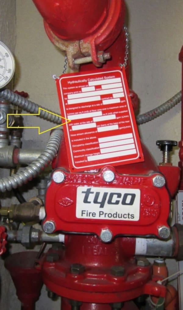 A blank hydraulic calculation sign hung on a fire sprinkler system