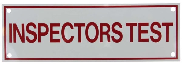 Rectangular sign with red text reading "inspectors test"