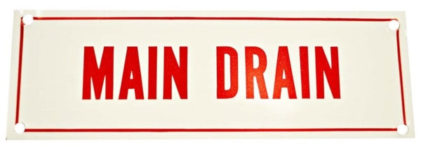 Aluminum sign reading "main drain" in red letters.
