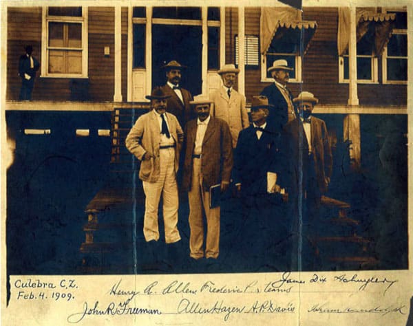 John Freeman pictured in front of a house with five other engineers
