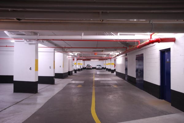 A dry pipe fire sprinkler system in a parking garage