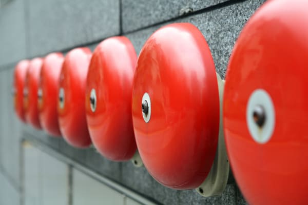 Several fire alarm bells mounted outside