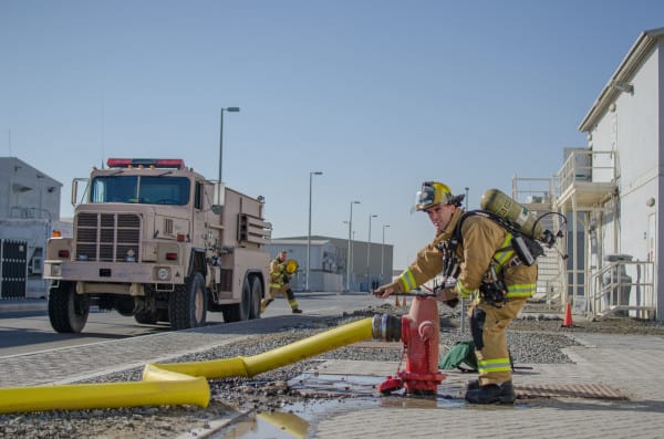 A firefighter at a hydrant