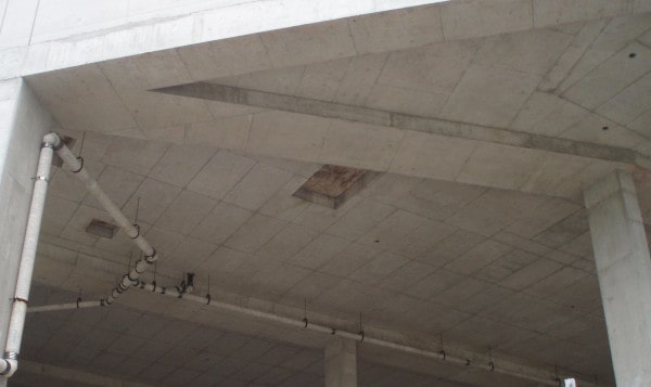 Pipes hanging from concrete