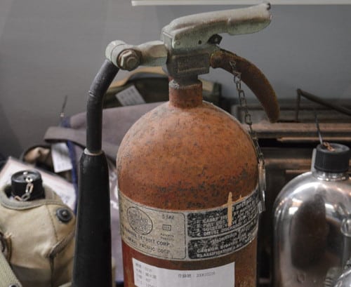 A rusted fire extinguisher