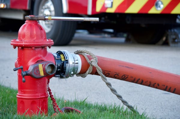 connecting hose to fire hydrant