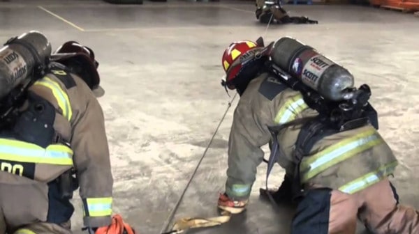 Firefighters using search rope