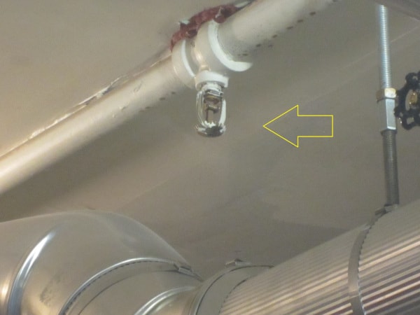 An incorrectly installed upright sprinkler head