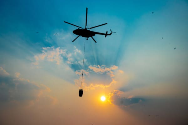 military helicopter fighting fires