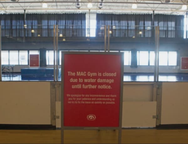 Sign showing gym closed due to water damage