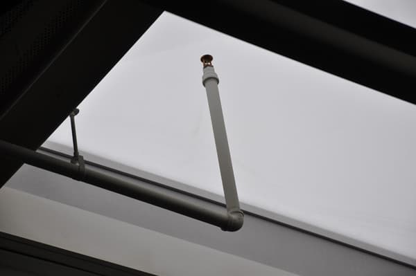 An upright fire sprinkler near a skylight