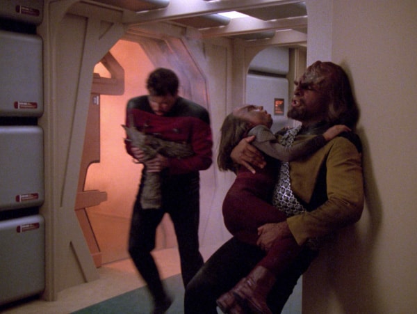 Worf and Riker save Alexander from a fire