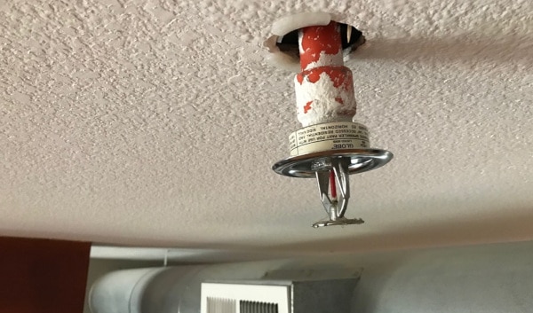 Sprinkler below the hole in a ceiling