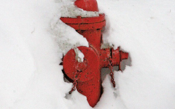 Fire hydrant covered by snow