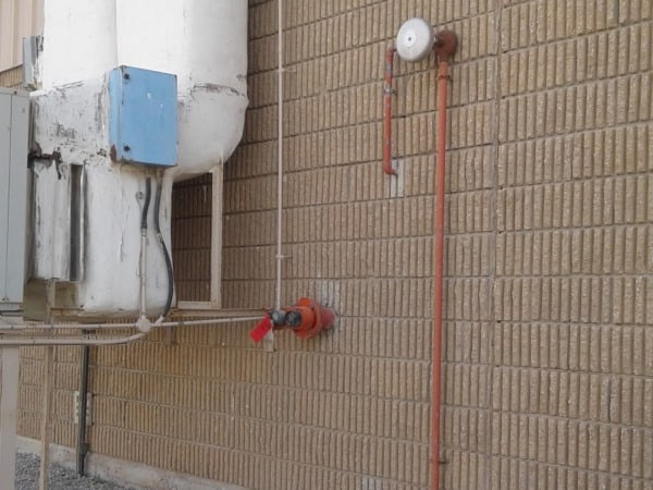Water motor gong installed on a wall