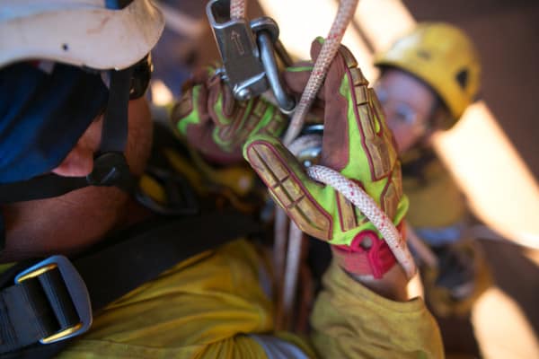 Rescuers using life safety rope