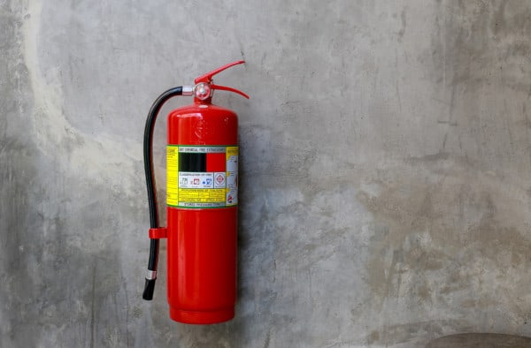 A wall-mounted fire extinguisher
