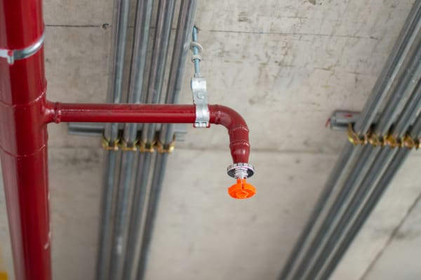 Fire sprinkler with cap
