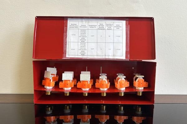 Spare fire sprinklers cabinet with complete list