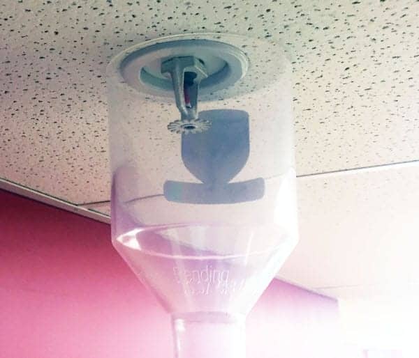 Cleaning fire sprinklers with a SprinklerVac