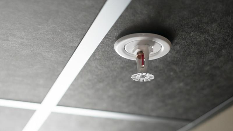 Quick response fire sprinkler in a ceiling